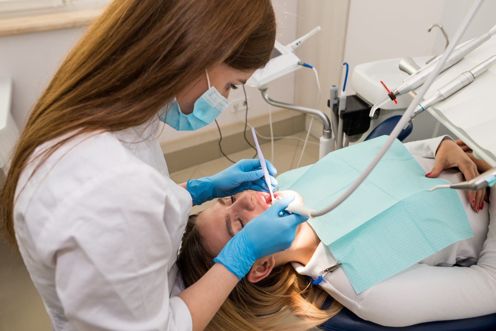 A dentist carrying out a gentle check-up at AllClear Dental Centre in Croydon